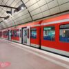 A red S-Bahn train at Hamburg Airport, Germany.