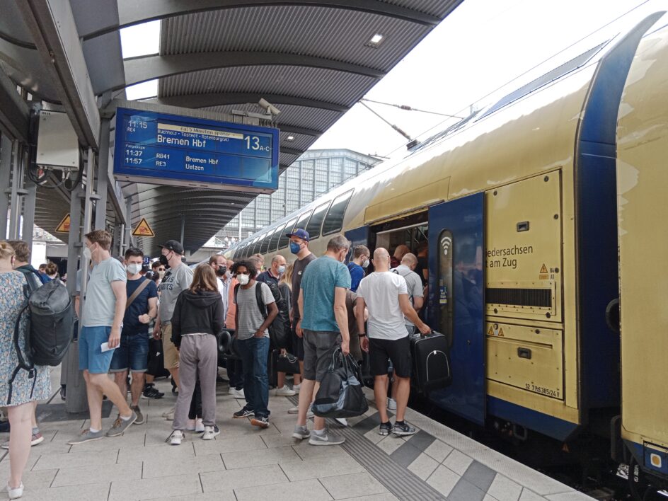 People waiting to get on a train