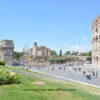 Wide shot of the Colosseum on the right, Velian Hill in the center, and Arch of Constantine on the left in Rome, Italy.