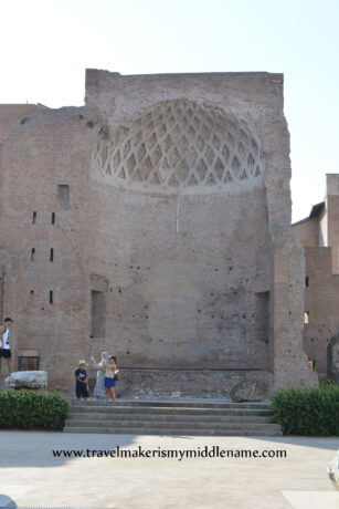 The Temple of Venus and Roma in Rome, Italy. Only half the temple remains: a cylindrical cross section of a building made of stone.