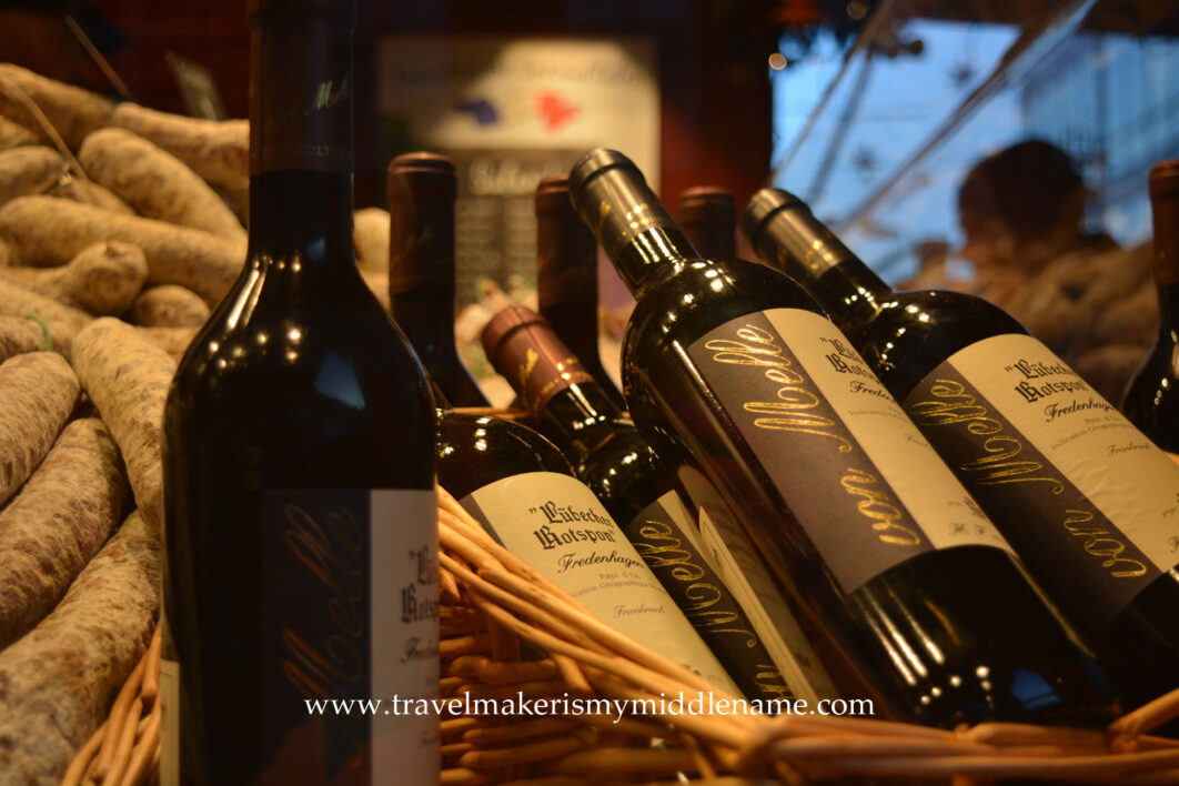 Bottles of wine in a basket at a Chiristmas market