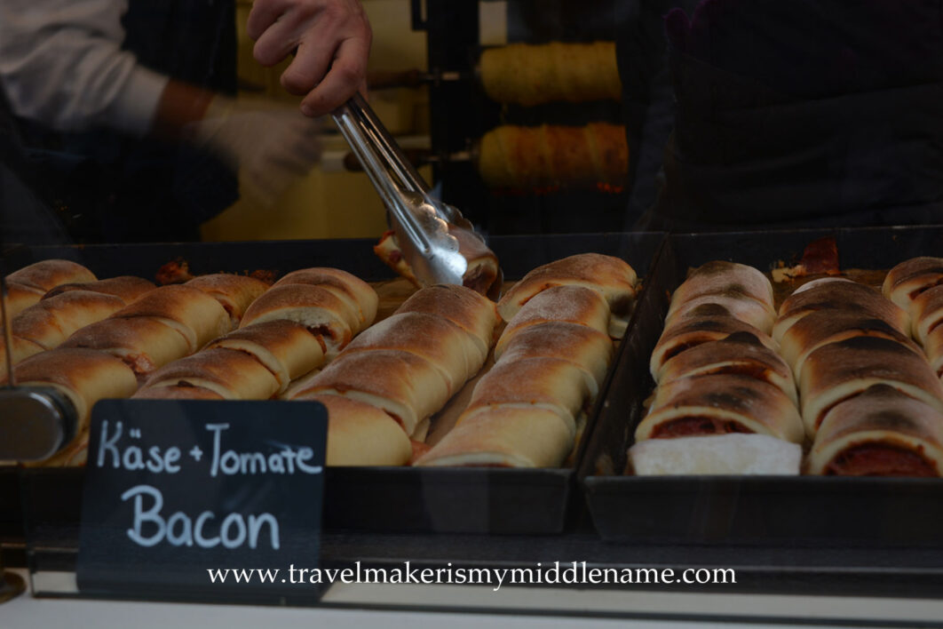 Baked cheese, tomato an bacon rolls