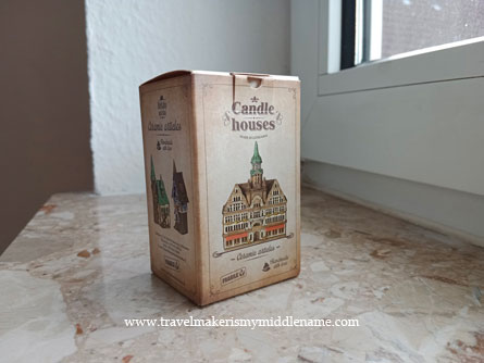 A small hand made incense smoker house in a thin protective cardboard box