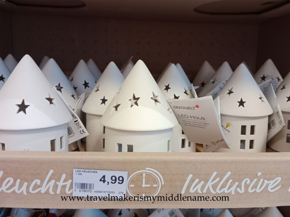 Light up LED white creamic cylindrical hut with a pointed roof that has stars and windows cut outs