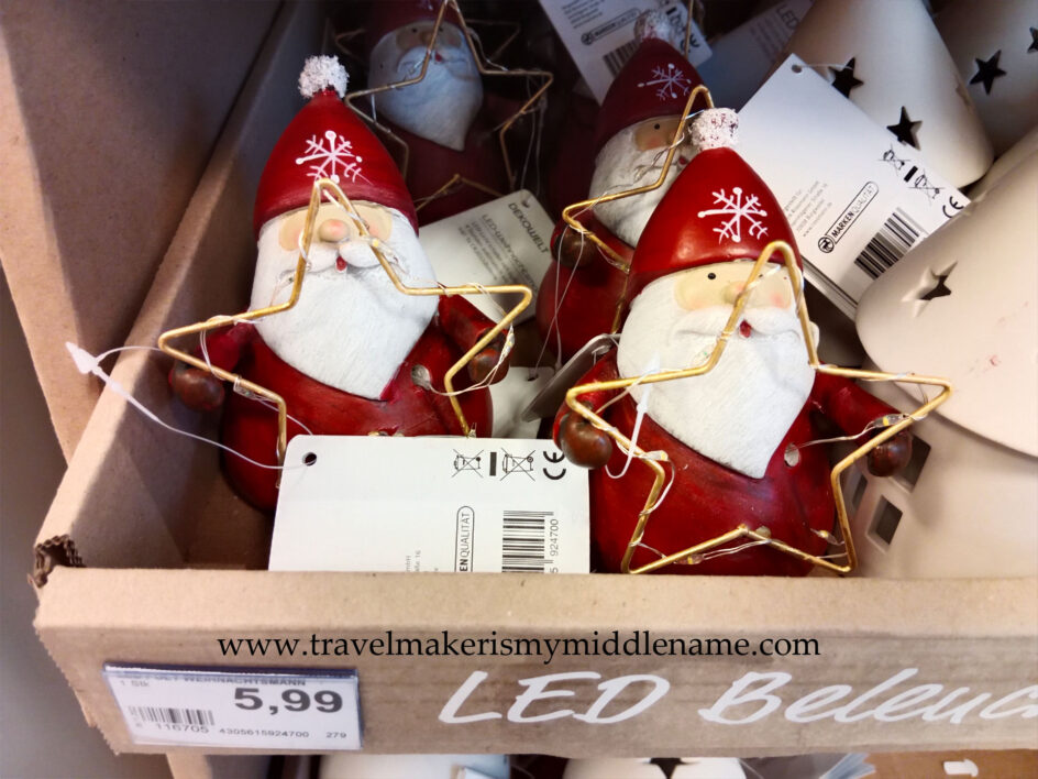 A Santa ornament holding a light up star
