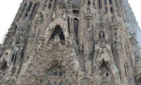 The facade and towering peaks of La Sagrada Familia church in Barcelona, Spain.