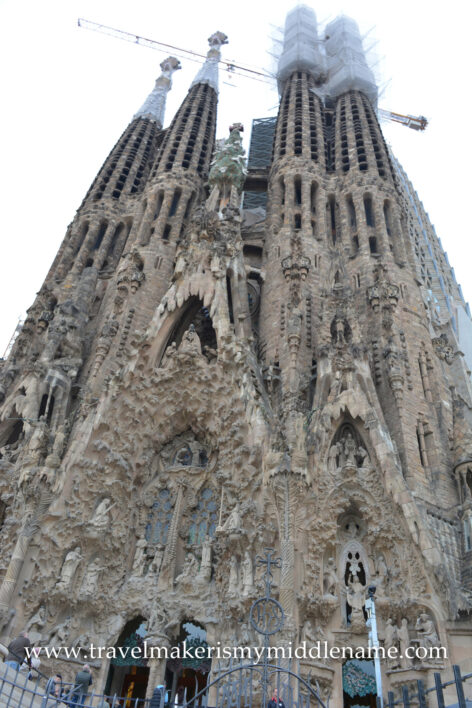 The facade and towering peaks of La Sagrada Familia church in Barcelona, Spain.