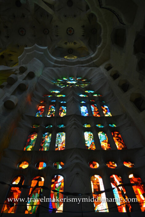 A wall of stained glass pictures in La Sagrada Familia church in Barcelona, Spain.