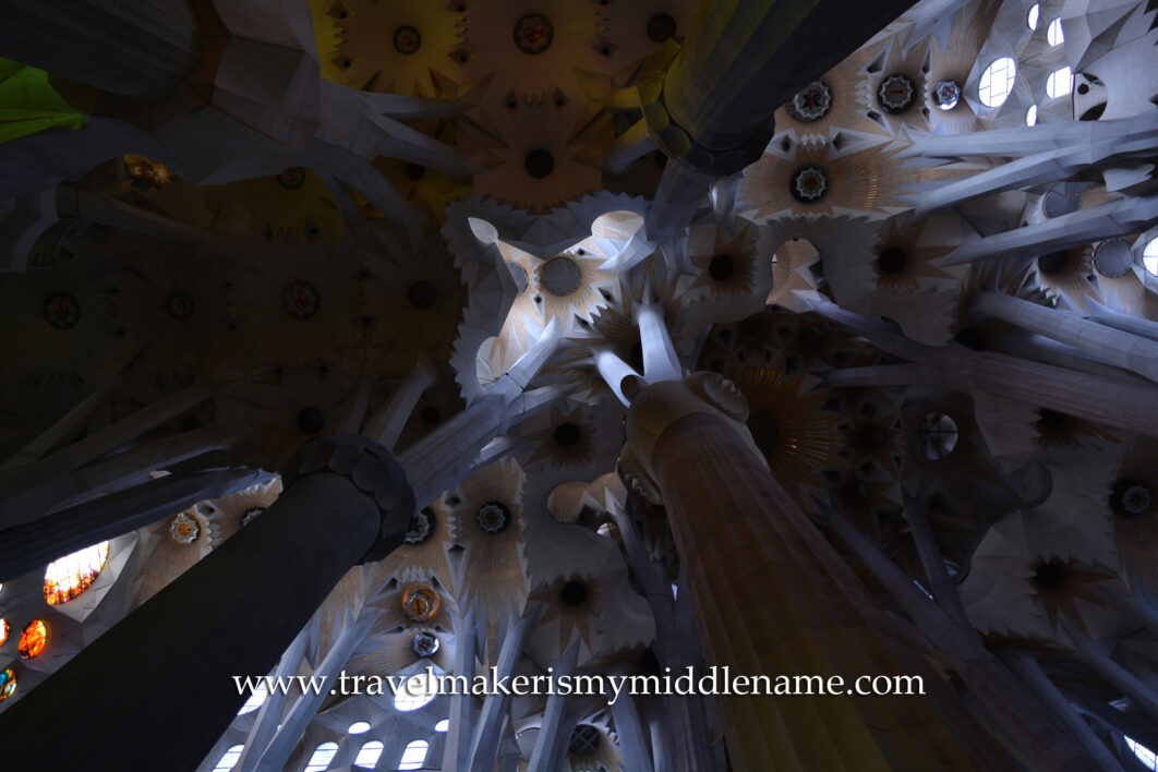 A worm's eye view of the white columns inside La Sagrada Familia churches in Barcelona, Spain.