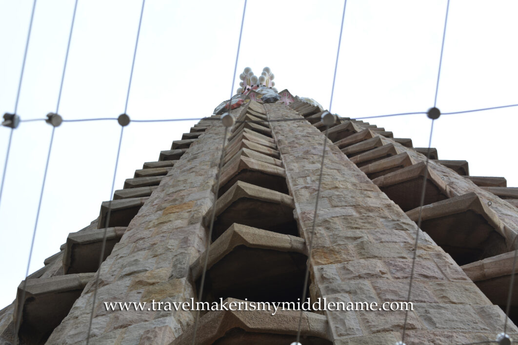 A view of one of the structures as seen outside the Passion tower in La Sagrada Familia church in Barcelona, Spain as seen at around 80 metres point outside the elevator. A metal mesh net covers the area for safety.