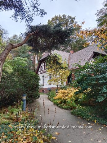 A traditional hip and gable roof half timbered house in the old botanical garden.
